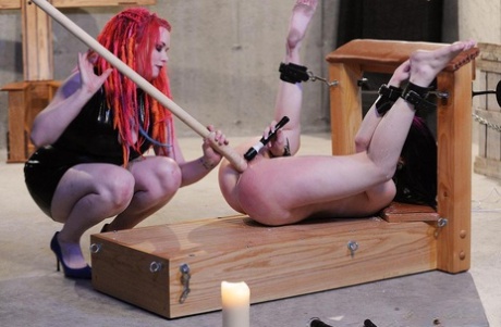 Redhead dyke makes her female slave masturbate herself to orgasm the hard way