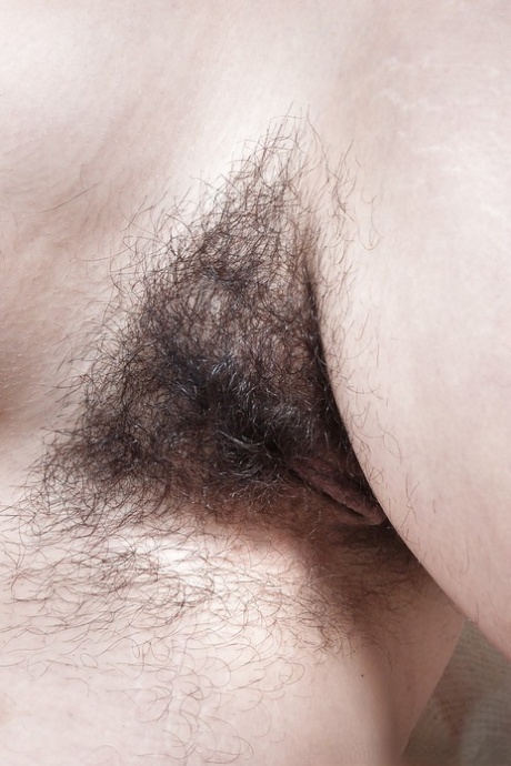 Chubby brunette babe with unshaven armpits and hairy cunt stripping