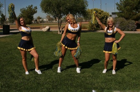 Big busted cheerleader Shyla Stylez has some anal fun with two studly lads