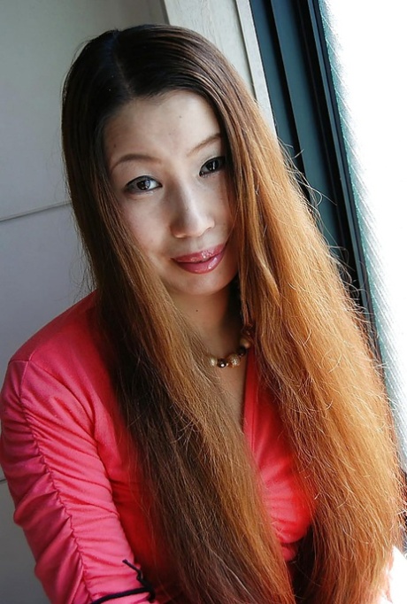 Asian MILF Ayako Sakuma undressing and showcasing her juicy cunt in close up