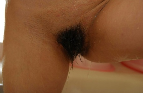 Asian teen with sexy fanny taking shower and teasing her hairy gash - pornpics.de