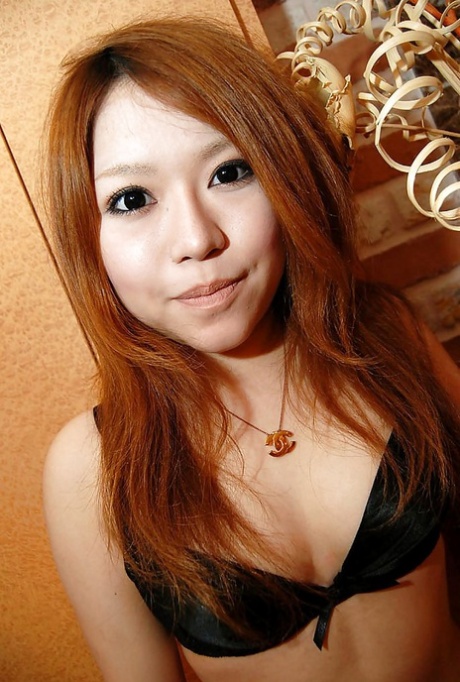 Asian teen Chiaki Eguchi undressing and exposing her hairy gash in close up - pornpics.de