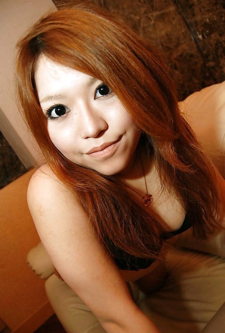 Asian teen Chiaki Eguchi undressing and exposing her hairy gash in close up - pornpics.de