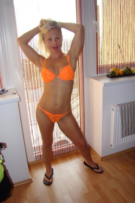 Czech blonde Sharka Blue posing in exotic lingerie by the window - pornpics.de