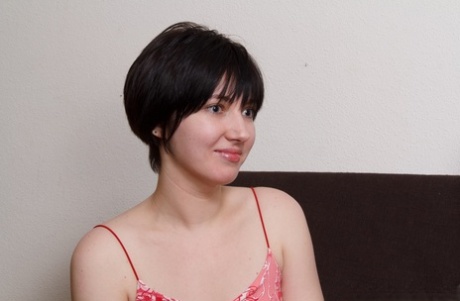 Short-haired teen Anastasiya C getting her bald snatch banged on the sofa