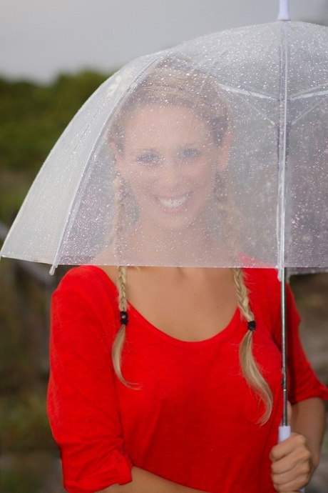 Playful blonde MILF Cherie Deville exposes her big tits & round ass outdoors