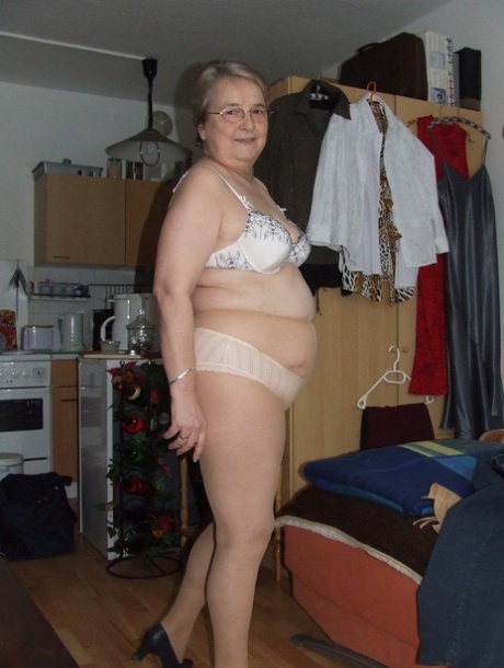 Fat European granny Sybille stripping off her clothes and skin tone tights - pornpics.de