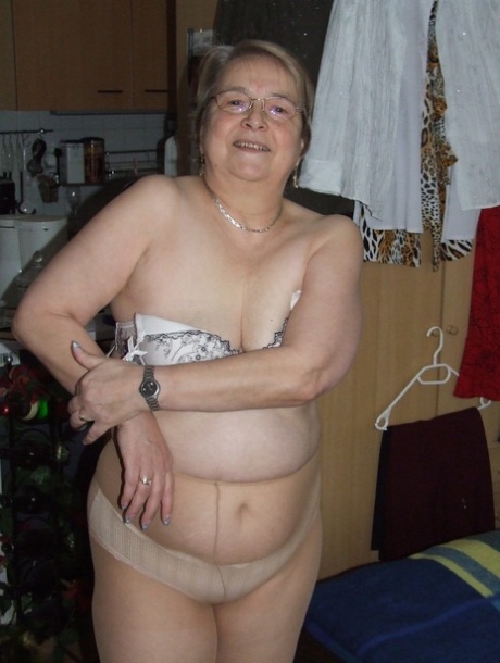 Fat European granny Sybille stripping off her clothes and skin tone tights - pornpics.de
