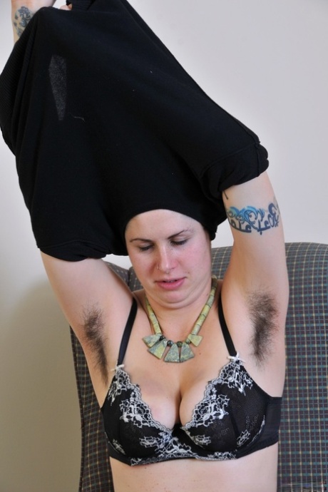 Raven haired slut Luna gets naked & touches her fuzzy beaver while watching TV