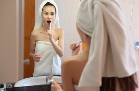Russian teen beauty Leona Mia loses her towel & flaunts her skinny body
