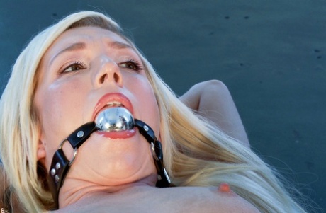Electro slut Maia Davis is strapped to a plexi glass box during lezdom play - pornpics.de