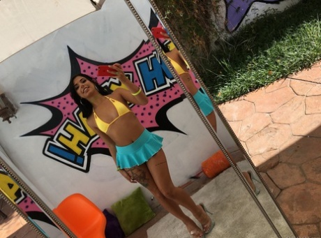 Brunette Latina Gina Valentina shows her big ass and perky tits outdoors