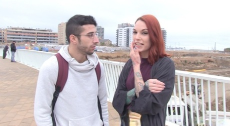 Tattooed redhead Silvia Rubi picks up a stranger for her next porn movie