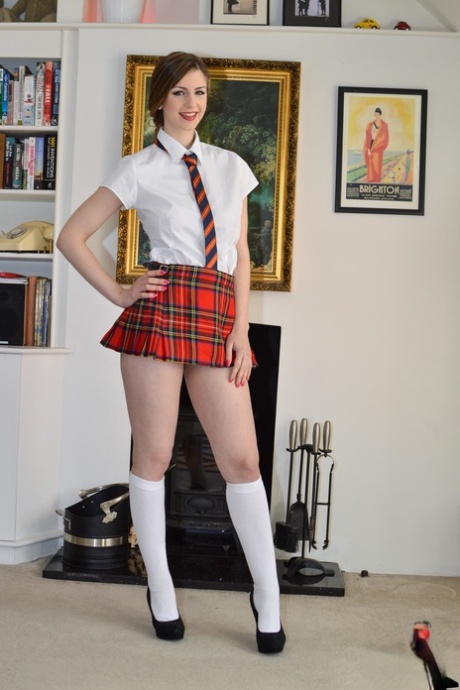 Cute sexy brunette schoolgirl Stella Cox toying in her uniform in solo action