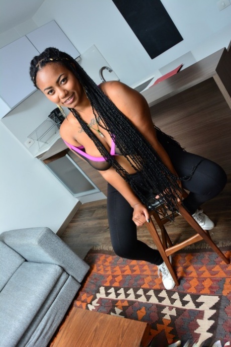 Ebony with dreads and massive tattooed butt teasing on the bar chair