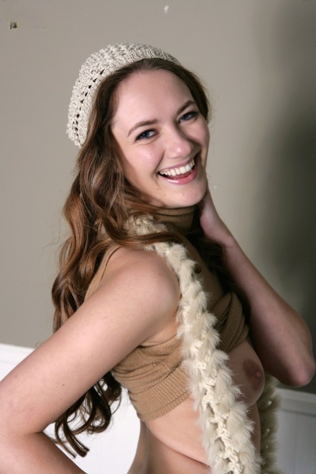 Charming young Samantha Hayes flashes her lovely natural tits wearing boots