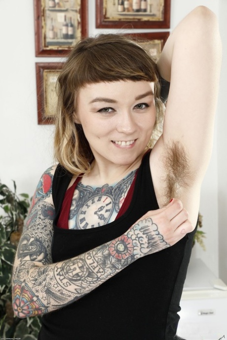 Heavily tattooed amateur Felicia Fisher reveals her hairy cunt and asshole