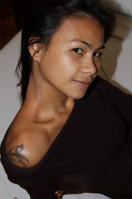 Asian babe Roanns Return shows her petite body and rubs her hairy muff