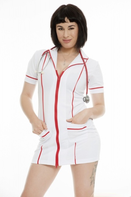 Stunning nurse Olive Glass slowly takes off uniform and shows her sexy body