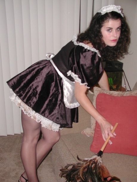 Black haired maid Michelle lifts her skirt up and drills her cunt with a toy