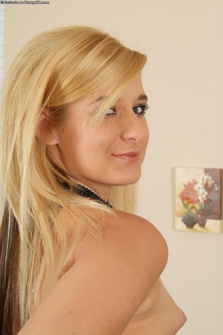 Sexy amateur Brittney shows off her big booty and spreads her shaved pussy
