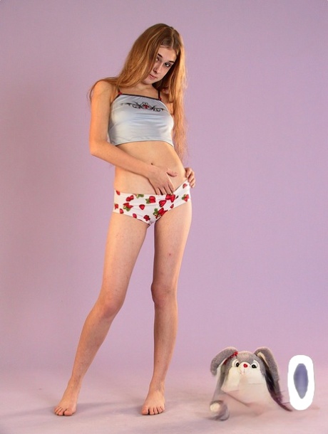 Long-legged amateur teen Lera strips her shirt & panties to pose nude