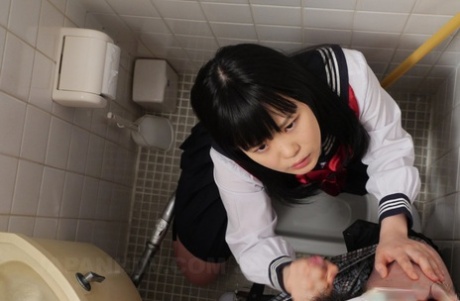 Sexy Japanese teen Sayaka Aishiro giving a gentle blowjob in a public toilet - pornpics.de