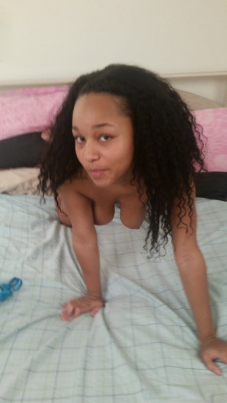 Adorable ebony Alana reveals her lovely breasts and jerks off a white dong