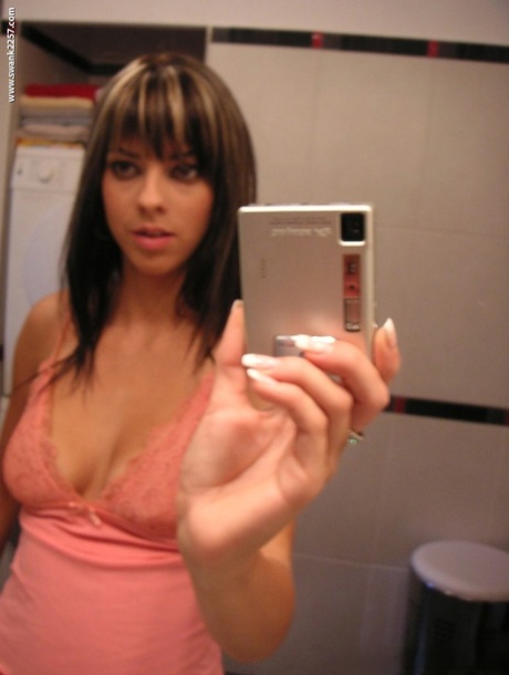 Hot girlfriend Mellie Swan takes selfies of her big natural tits in the mirror