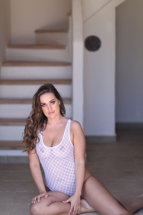 Young honey Frankie L reveals her ass and tits in solo action on the stairs