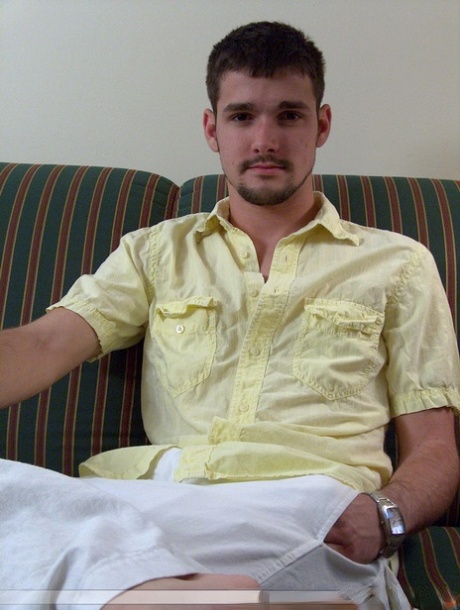 Brunette twink Dominic poses topless and proudly shows his stiff dick