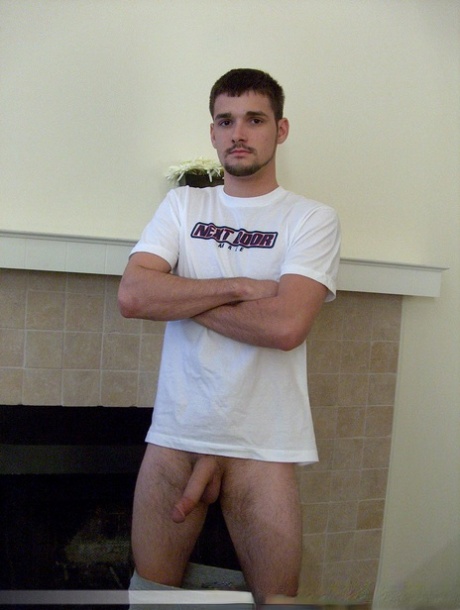 Brunette twink Dominic poses topless and proudly shows his stiff dick