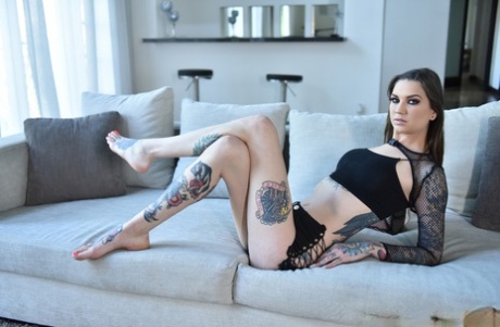 Tall brunette Rocky Emerson uses her sexy tattooed feet to wank a cock - pornpics.de