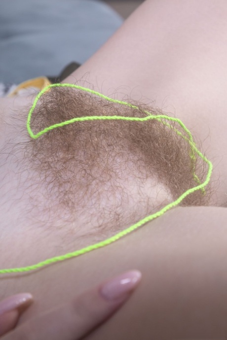 Amateur geek Abby spreading and toying her furry pussy in a solo