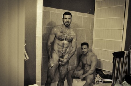 Muscular gay men give each other a blowjob and have doggystyle anal sex