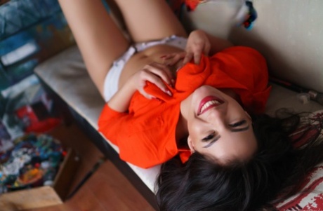 Beautiful brunette babe Jacqueline Davis flashes her small tits