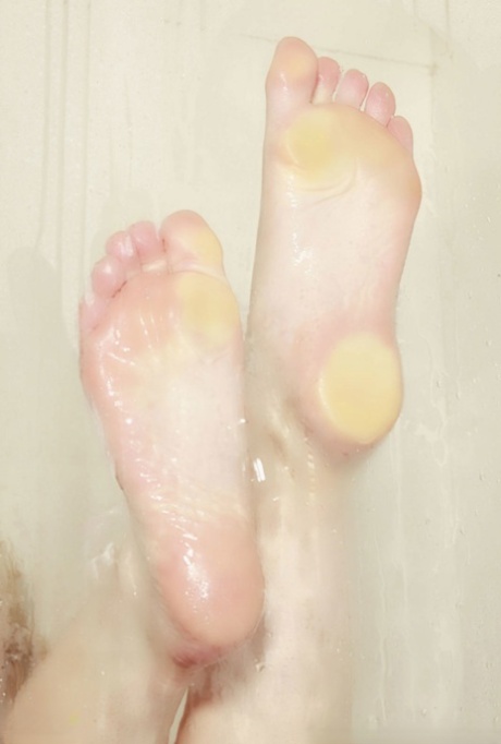 Sexy MILF Kayden Kross exposing her big tits, hot feet and clit in the shower