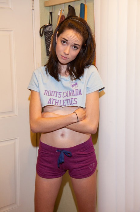 Flexible teenage girlfriend Emily Grey poses in cute shorts and panties