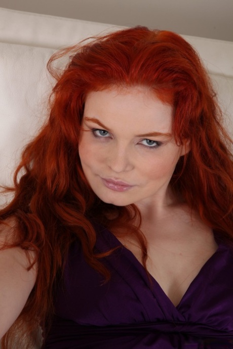 Redheaded MILF with small tits Barbara Babeurre toys her hairy pussy