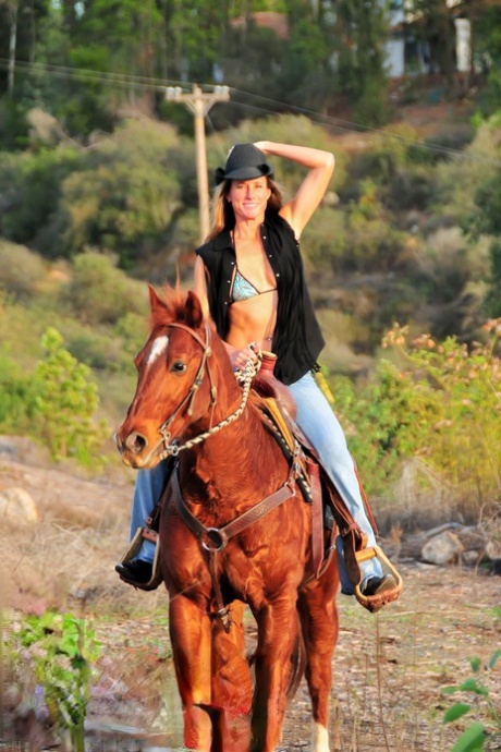 Horny lady Sofie Marie stripping and posing after an outdoor horse ride - pornpics.de
