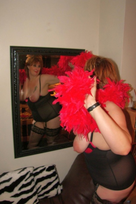 Chubby mature wife Roxy K teasing with her big hanging tits in nylons