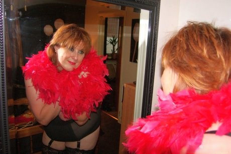 Chubby mature wife Roxy K teasing with her big hanging tits in nylons