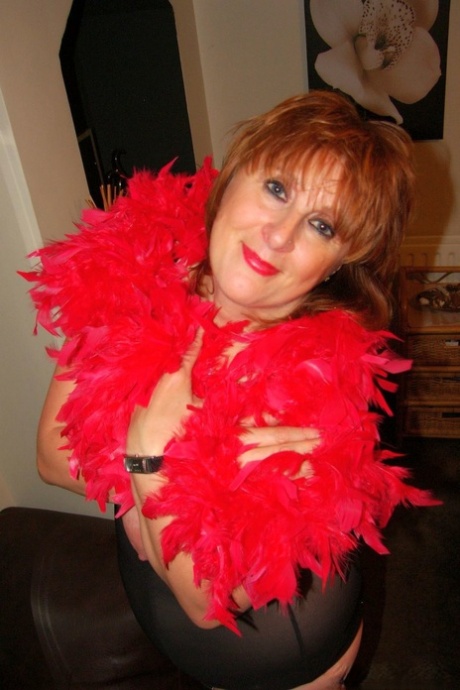 Chubby mature wife Roxy K teasing with her big hanging tits in nylons