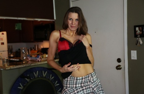 Very hot American mom Valerie Voxx undresses and gives a nasty handjob