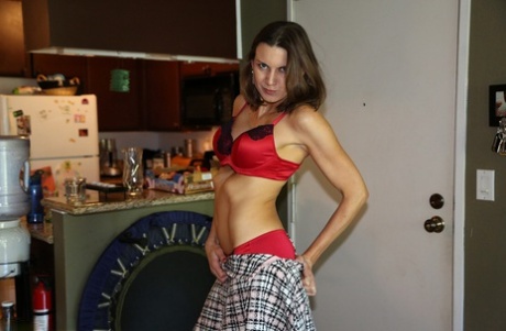 Very hot American mom Valerie Voxx undresses and gives a nasty handjob