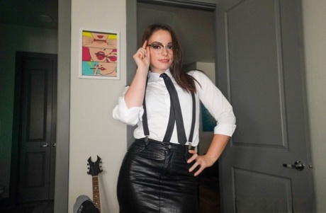 Brunette teen in glasses Sophia Burns strips and gives a blowjob for a facial