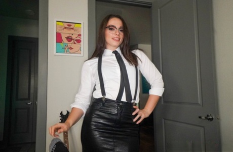 Brunette teen in glasses Sophia Burns strips and gives a blowjob for a facial