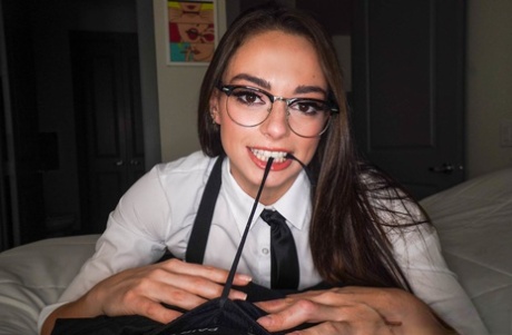 Brunette teen in glasses Sophia Burns strips and gives a blowjob for a facial