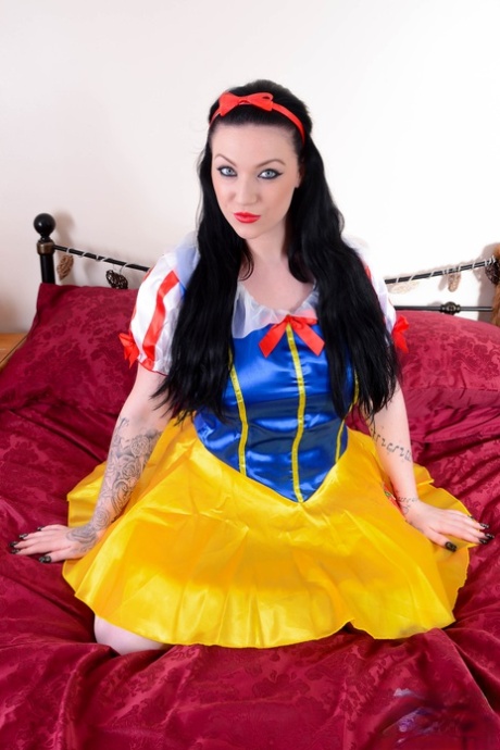 Curvaceous British model Harmony Reigns posing dressed as a Snow White