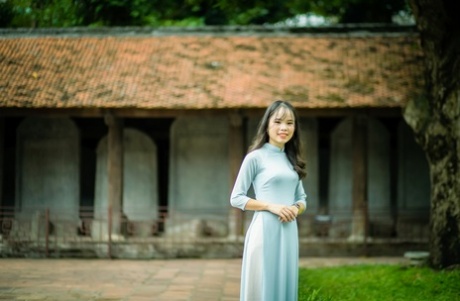 Beautiful Vietnamese girl in a sexy dress Ao Dai gets caught in public